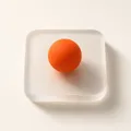 Holvine emblem — a frosted-glass tile with an orange sphere
